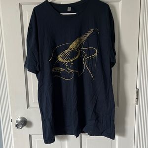 Navy shirt with gold guitar